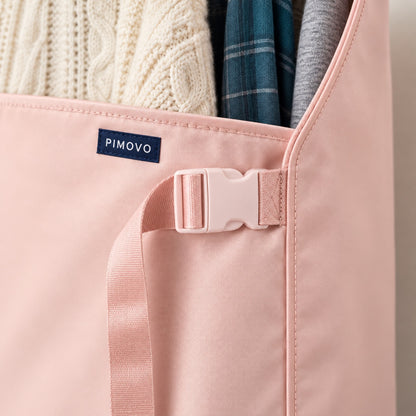 PIMOVO branding concept showing a navy woven label, pink plastic clasp, adjustable strap and satin fabric.